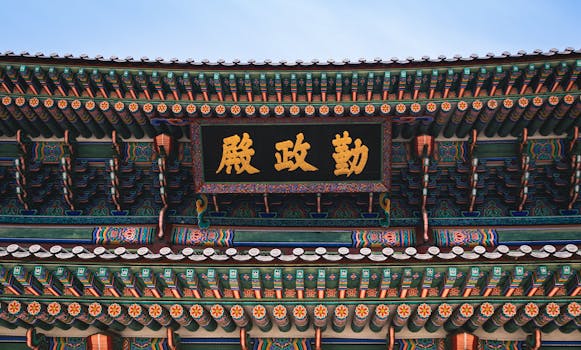Close-up of the ornate roof architecture of Gyeongbokgung Palace in Seoul, Korea, showcasing traditional design and craftsmanship.